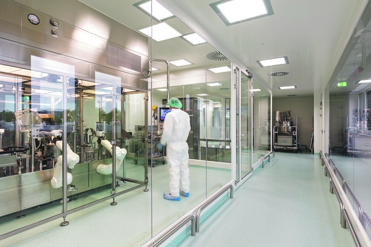 Vial-filling robot in sterile production area at the new compounding pharmacy...